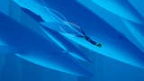 A screenshot from the underwater game Abzu, where a slight diver swims along with blue whales. There's a slightly simplified, illustrative look to the world.