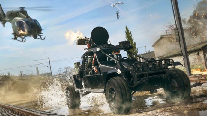 call of duty warzone urzikstan, the new coyote off road vehicle is being followed along train tracks by a helicopter.